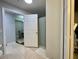 Bathroom with tiled floors, a shower, and an open door leading to the dining room at 8300 Elm Park Dr # 7110, Orlando, FL 32821