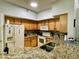 Charming kitchen boasting granite countertops, tile backsplash, and ample cabinet space at 8300 Elm Park Dr # 7110, Orlando, FL 32821