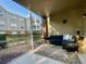 Cozy screened patio with outdoor seating and views of the landscaped surroundings at 8300 Elm Park Dr # 7110, Orlando, FL 32821