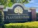 Elegant Plantation Park sign indicating 'Luxury Condominiums' surrounded by manicured landscaping at 8300 Elm Park Dr # 7110, Orlando, FL 32821