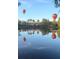 Scenic view of hot air balloons reflected in the water, creating a peaceful community vista at 8300 Portofino Dr # 403, Davenport, FL 33896