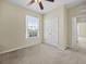 Neutral bedroom featuring carpet, a large closet, and a ceiling fan at 8300 Portofino Dr # 403, Davenport, FL 33896