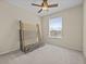 Bedroom featuring neutral walls, carpet flooring, ceiling fan, and window at 8300 Portofino Dr # 403, Davenport, FL 33896