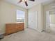 Well-lit bedroom featuring neutral walls, carpet, a large closet, and a ceiling fan at 8300 Portofino Dr # 403, Davenport, FL 33896