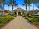 Exterior of clubhouse with inviting entrance and manicured landscaping at 8300 Portofino Dr # 403, Davenport, FL 33896