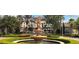 Beautiful fountain located in the Bella Trae at Champions Gate community, surrounded by lush landscaping at 8300 Portofino Dr # 403, Davenport, FL 33896