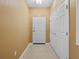 Bright entryway with neutral paint, tiled floor, and a closet near the front door at 8300 Portofino Dr # 403, Davenport, FL 33896