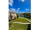 Beautiful exterior view of the apartments with pond and fountains at 8300 Portofino Dr # 403, Davenport, FL 33896