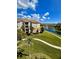 Beautiful exterior view of the apartments with pond at 8300 Portofino Dr # 403, Davenport, FL 33896