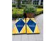 Set of cornhole boards featuring the Bella Trae logo, perfect for outdoor entertainment and fun at 8300 Portofino Dr # 403, Davenport, FL 33896
