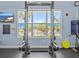 Bright gym features natural light and equipment; poolside views enhance the workout experience at 8300 Portofino Dr # 403, Davenport, FL 33896