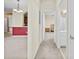 Hallway view showing an open floor plan with a glimpse into the bathroom and bedroom at 8300 Portofino Dr # 403, Davenport, FL 33896