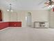 Open living room featuring neutral carpet, ceiling fan, and view of another room at 8300 Portofino Dr # 403, Davenport, FL 33896