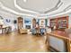 Lounge with wood floors, fireplace, bookshelves, and comfortable seating at 8300 Portofino Dr # 403, Davenport, FL 33896
