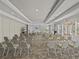 Conference room featuring chairs, tables, and a presentation screen at 8300 Portofino Dr # 403, Davenport, FL 33896