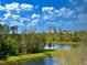 Enjoy beautiful views of nature with the trees and pond at 8300 Portofino Dr # 403, Davenport, FL 33896