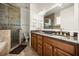 Bathroom featuring double sinks, vanity with granite counters, tile shower and garden tub at 861 Golden Bear Dr, Reunion, FL 34747