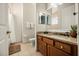 Bathroom featuring a vanity with a granite counter, shower and neutral tile at 861 Golden Bear Dr, Reunion, FL 34747