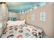 Themed bedroom with castle walls, a Harry Potter comforter, and castle-themed windows at 861 Golden Bear Dr, Reunion, FL 34747
