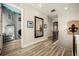 Upstairs hallway with wood floors, decorative wrought iron railings, and access to themed bedroom at 861 Golden Bear Dr, Reunion, FL 34747