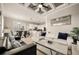 Open-concept living space features modern furniture, a dining area, and seamless transition to the kitchen at 861 Golden Bear Dr, Reunion, FL 34747