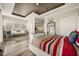 Open and airy main bedroom with sitting area, en suite and natural light at 861 Golden Bear Dr, Reunion, FL 34747