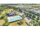 Aerial community shot showcases pool and playground amenities, set against a lush backdrop at 1000 Seburn Rd, Apopka, FL 32703