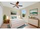 Bright bedroom featuring a ceiling fan, neutral walls, and coordinated furniture and decor at 1000 Seburn Rd, Apopka, FL 32703