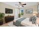 Modern bedroom featuring a TV, sleek furniture, and a calming color scheme at 1000 Seburn Rd, Apopka, FL 32703