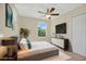 Comfortable bedroom featuring a ceiling fan, neutral walls, and coordinated furniture at 1000 Seburn Rd, Apopka, FL 32703