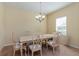 Traditional dining room with carpet flooring and a chandelier above the table at 1000 Seburn Rd, Apopka, FL 32703