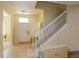 Bright entryway with tile flooring, staircase, and neutral paint at 1000 Seburn Rd, Apopka, FL 32703