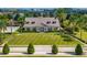 Beautiful exterior of property with well-manicured lawn, landscaping, and symmetrical design elements at 1000 Seburn Rd, Apopka, FL 32703