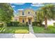 Inviting two-story home featuring a well-maintained lawn, lush landscaping, and a welcoming facade at 1000 Seburn Rd, Apopka, FL 32703
