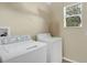 Bright laundry room equipped with a washer and dryer, ready for use at 1000 Seburn Rd, Apopka, FL 32703