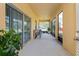 Large screened-in porch with seating area and view of the surrounding landscape at 1000 Seburn Rd, Apopka, FL 32703