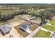 A newly built home on a vast lot, featuring a private driveway, a new lawn, and a garage at 110 Alta Vista Way, Davenport, FL 33837