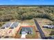 A beautiful new construction house with a large lot, private driveway, and surrounded by trees and nature at 110 Alta Vista Way, Davenport, FL 33837