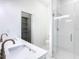 Bathroom featuring a shower, dual sink vanity and open closet at 110 Alta Vista Way, Davenport, FL 33837