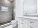 Well-lit bathroom featuring tiled shower, marble vanity top, and modern finishes at 110 Alta Vista Way, Davenport, FL 33837