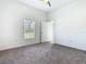Bedroom featuring a ceiling fan, a window, and an open door at 110 Alta Vista Way, Davenport, FL 33837