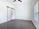 Spacious bedroom featuring a sliding door and a window with blinds at 110 Alta Vista Way, Davenport, FL 33837