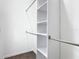 Walk-in closet featuring built-in shelving and metal hanging rods for optimal organization and storage solutions at 110 Alta Vista Way, Davenport, FL 33837