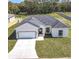 Well-maintained single-Gathering home with two-car garage and green lawn at 110 Alta Vista Way, Davenport, FL 33837