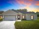 Charming single-Gathering home with a well-manicured lawn and two-car garage at 110 Alta Vista Way, Davenport, FL 33837