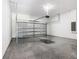 Spacious garage with sealed floor, overhead door, and ample storage space at 110 Alta Vista Way, Davenport, FL 33837
