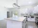 Bright and airy kitchen with stainless steel appliances and gray backsplash at 110 Alta Vista Way, Davenport, FL 33837