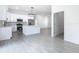 Bright kitchen features white cabinets, stainless steel appliances and gray backsplash at 110 Alta Vista Way, Davenport, FL 33837
