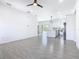 Open concept living room with tile flooring and bright lighting at 110 Alta Vista Way, Davenport, FL 33837