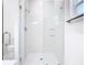 All-glass walk-in shower featuring stylish tile and modern fixtures at 110 Alta Vista Way, Davenport, FL 33837